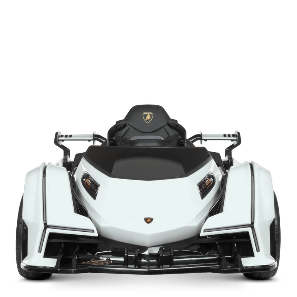 Front view of the White 12V Official Lamborghini Vision GT Kids Ride on Car, featuring a sleek, angular design with black accents and a logo on the seat back. With exposed front wheels and minimalistic styling, this futuristic go-kart exudes modern sportiness for kids adventures.