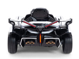 The White 12V Official Lamborghini Vision GT Kids Ride-On car features a sleek black and white design with red accents, dual exhaust, racing seat, and detailed rear lights for an ultimate driving experience.
