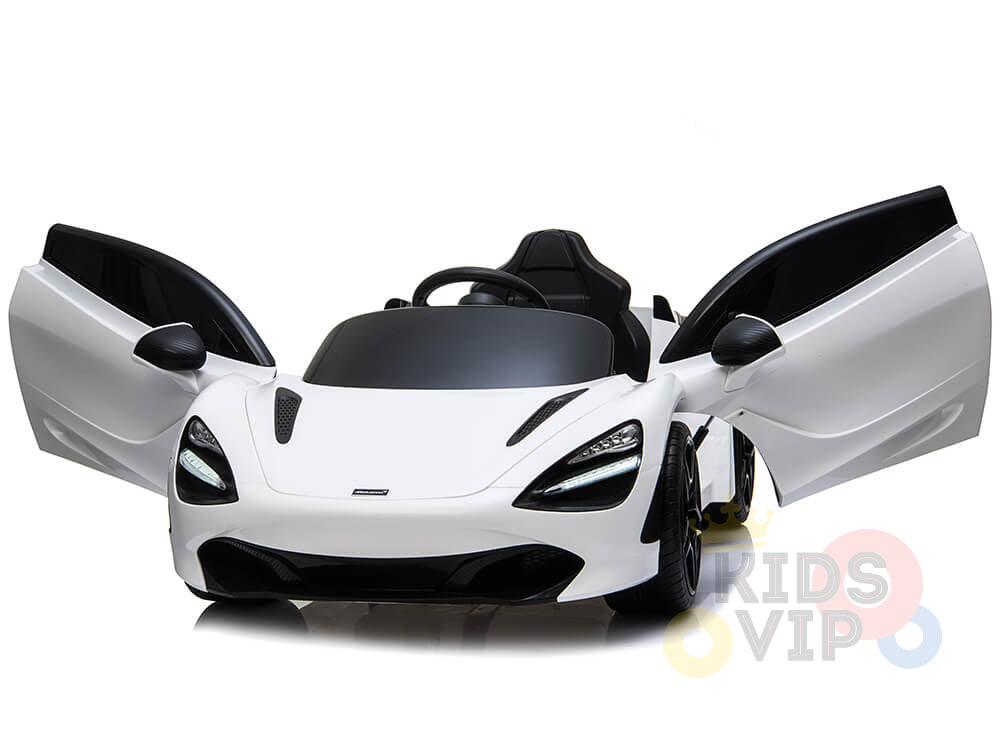The White 12V McLaren 720S Kids Licensed 1 Seater Ride On Car boasts a sleek design with LED lights, black detailing, and upward opening doors. Subtle KIDS VIP branding hints at its remote control capabilities.