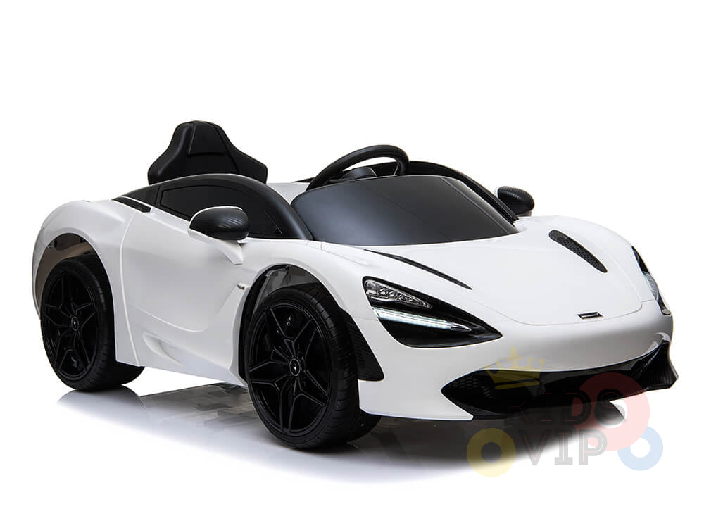 This White 12V McLaren 720S Kids Licensed Ride On Car features upgraded details like a black seat, tinted windows, rubber wheels, headlights, and side mirrors.