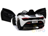 The White 12V McLaren 720S Kids Licensed Ride On Car features a black interior with a sporty steering wheel and upgraded elements. Both doors are open, revealing the sleek design with visible rear lights and 720S on the license plate, positioned diagonally for maximum effect.