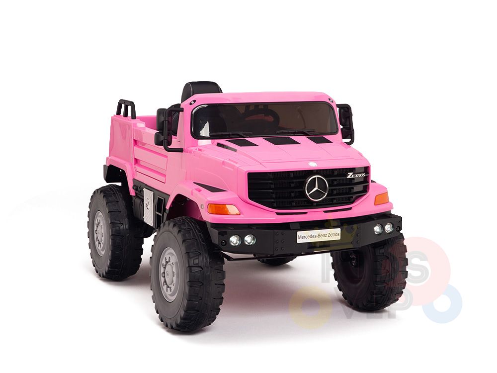 The Pink 12V Mercedes Benz Zetros Kids Ride-On Truck, with sleek rubber wheels and Mercedes logo grille, features a comfy black seat, side mirrors, prominent headlights, and a remote control for ultimate fun.