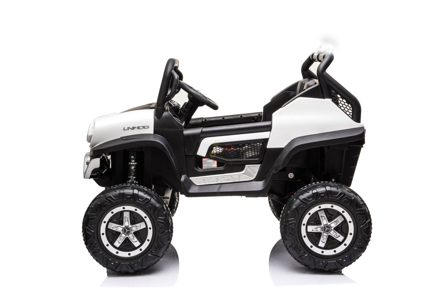 The White 12V/4X4 Official Mercedes Unimog Junior Ride On UTV is a childrens electric SUV-style toy car with large rugged tires, a sleek design, steering wheel, detailed interior, and roll bars. Its perfect for adventurous young drivers and includes remote control functionality.