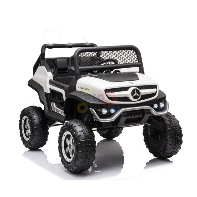 The White 12V/4X4 Official Mercedes Unimog Junior Ride On UTV is a toy resembling an off-road Mercedes-Benz, with a black grille and large tires. It boasts realistic features like a roll bar and side mirrors, providing young adventurers with an exciting ride.