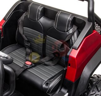 The black leather seat with seat belts and red trim complements the sleek design of the White 12V/4X4 Official Mercedes Unimog Junior Ride On UTV, Remote Control, featuring black stitching and plastic elements for a clean and stylish interior.