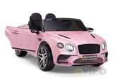 The Pink 12V Bentley GTC Kids Licensed Ride-On Car features black seats, realistic headlights, alloy-style wheels, one open door, and visible branding. It includes a parental remote for safety and rubber wheels for a smooth ride.
