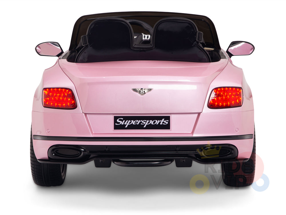 Rear view of the Pink 12V Bentley GTC Kids Licensed Ride On Car with red taillights and Supersports on the license plate area, part of the Bentley Ride Ons collection. The convertible toy features two seats visible from the back.