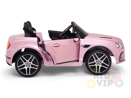 The Pink 12V Bentley GTC Kids Licensed Ride On Car features rubber wheels, opening doors, and two sleek black seats. KIDS VIP is printed on it, providing a safe driving experience for kids with its parental remote control.