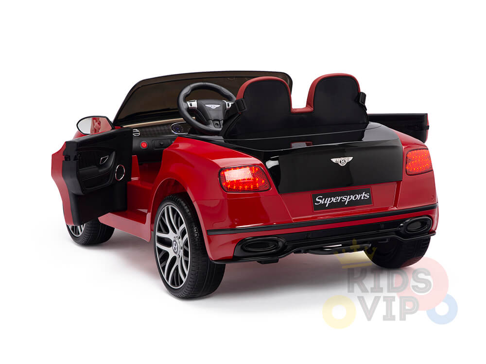 The Red 12V Bentley GTC Kids Licensed Ride On Car features a realistic design, open drivers door, black interior, detailed dashboard, rubber wheels, and Supersports logo on the rear. It’s powered by a 12V motor and includes a remote for exhilarating rides.