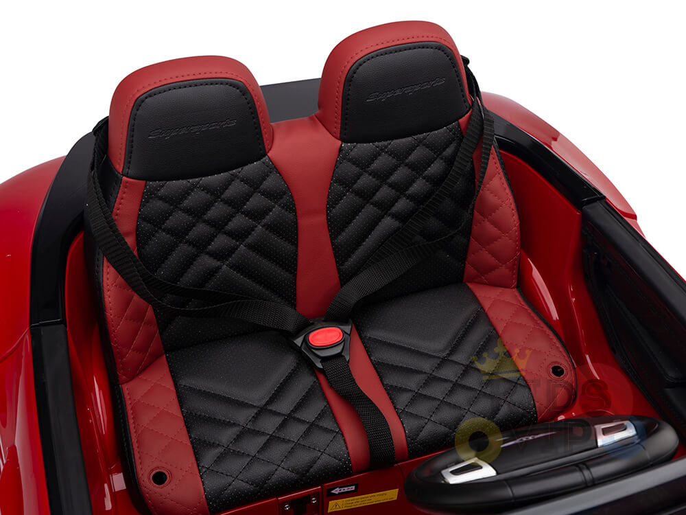The Red 12V Bentley GTC Kids Licensed Ride On Car, featuring plush black and red seats with diamond stitching and embossed logos, offers luxury for young adventurers. Inside the red convertible shell, a chic steering wheel awaits little drivers eager for excitement.