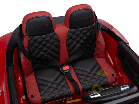 The Red 12V Bentley GTC Kids Licensed Ride On Car, featuring plush black and red seats with diamond stitching and embossed logos, offers luxury for young adventurers. Inside the red convertible shell, a chic steering wheel awaits little drivers eager for excitement.