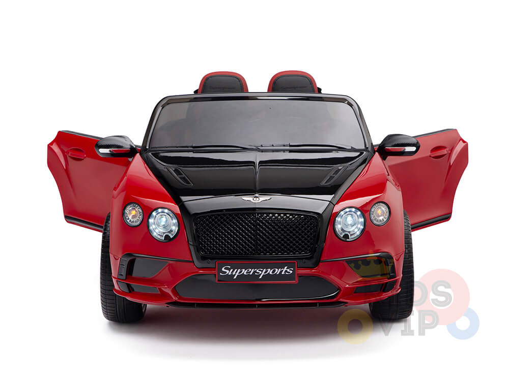 The front view of the red 12V Bentley GTC Kids Licensed Ride On Car with rubber wheels and remote displays its striking grille, open doors, two seats, and Supersports branding on the front, making it perfect for young adventurers.