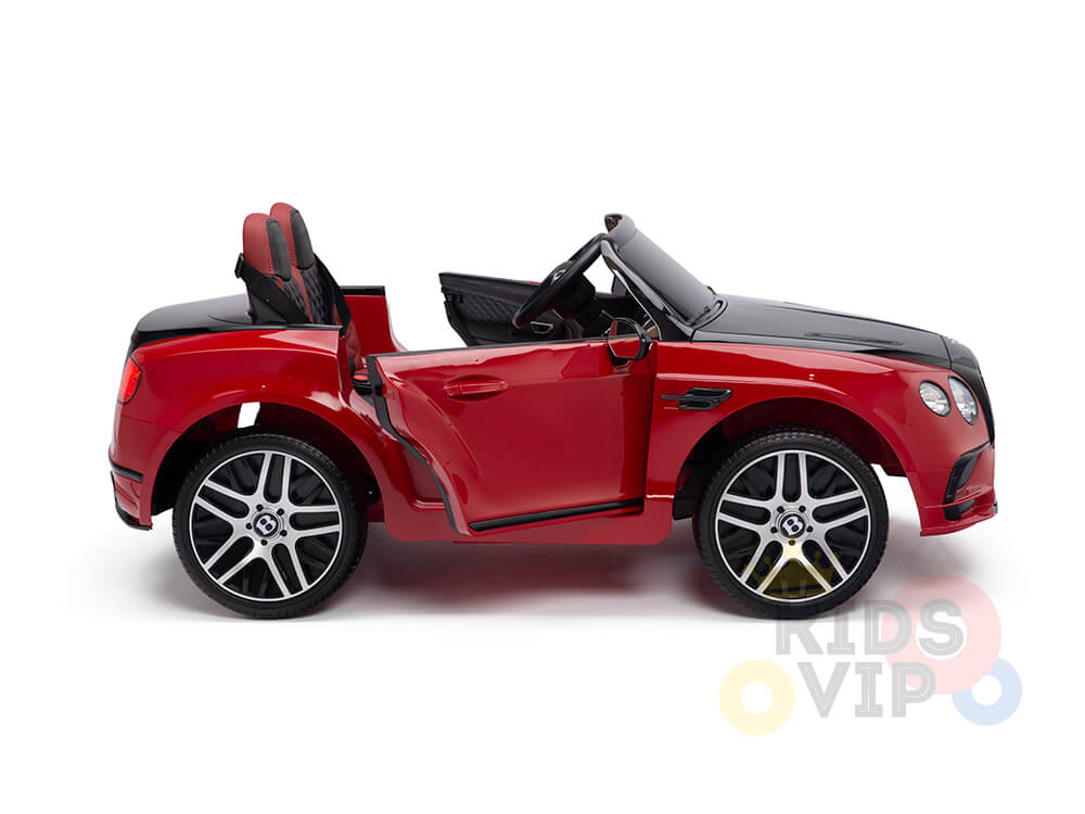A red 12V Bentley GTC Kids Licensed Ride On Car with black and red seats, open doors, shiny rubber wheels, resembling a luxury sports model, features the Kids VIP logo.
