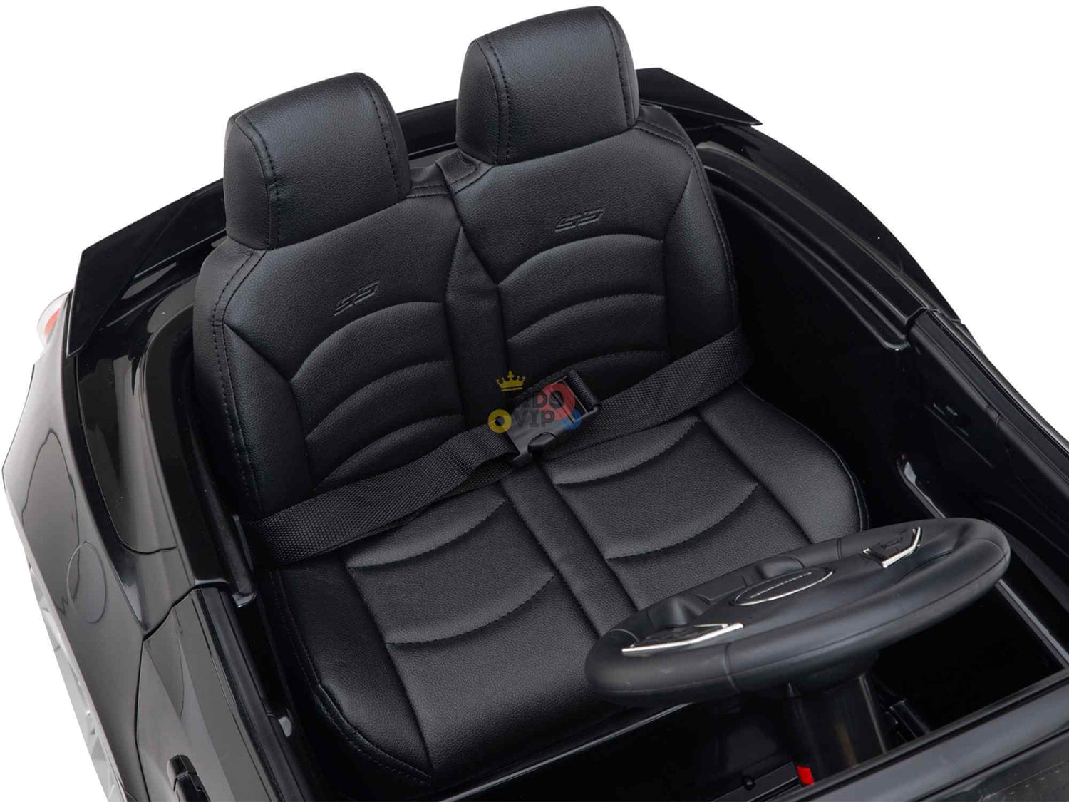 The Black Official Sport 12V Chevrolet Camaro Kids and Toddlers Ride on Car has a black interior with ECO leather-like seats, steering wheel, and safety belts. The seats textured finish matches the simple dashboard design, and Eva rubber wheels ensure a smooth ride.