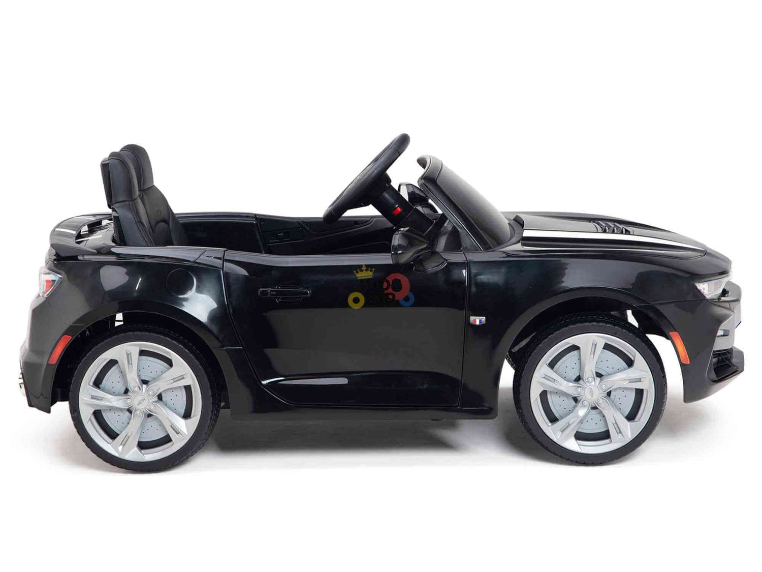The Black Official Sport 12V Chevrolet Camaro Kids and Toddlers Ride-on Car features a convertible design, silver rims, EVA rubber wheels, a detailed interior with a steering wheel, and an ECO leather seat. This sleek side view presents the toy as a sporty vehicle.