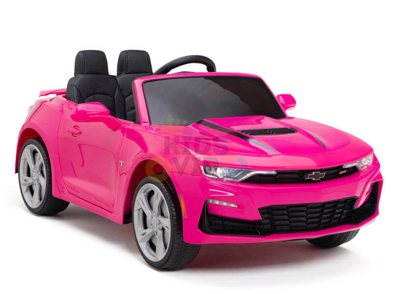 The Pink 12V Official Sport Chevrolet Camaro Kids Ride On Car boasts a vibrant pink finish, sleek design, black seats, silver rims, and realistic features such as headlights and a steering wheel.
