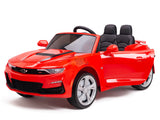 The Red 12V Official Sport Chevrolet Camaro Kids Ride-on Car features two black seats, headlights, mirrors, a small steering wheel, shiny silver wheels, and a front grille logo. This convertible-style car is thrilling for kids as it’s powered by a 12V battery.