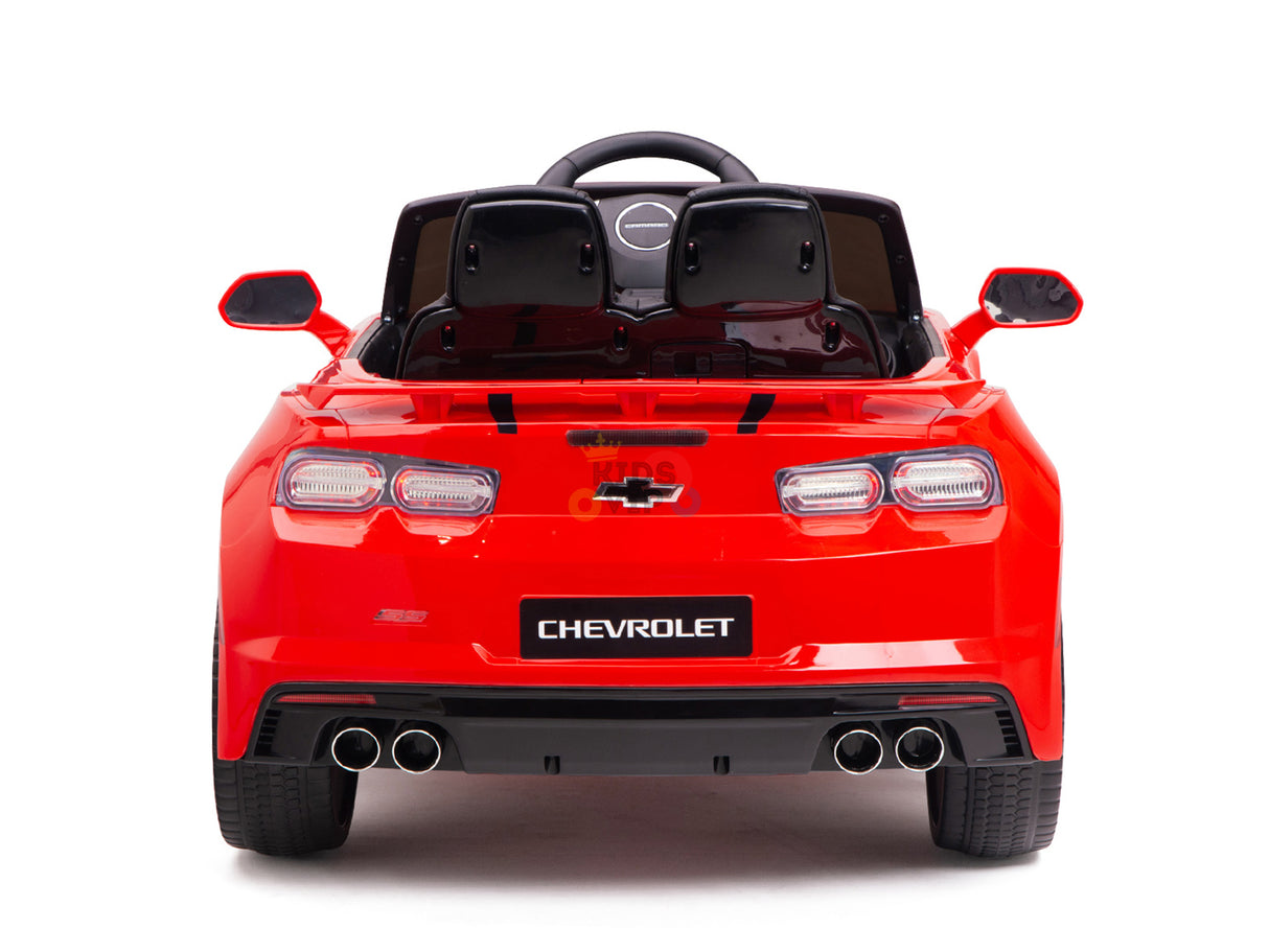 Back view of the Red 12V Official Sport Chevrolet Camaro Kids and Toddlers Ride-on Car, featuring realistic taillights, dual exhausts, a detailed bumper, remote control features, brand logo, side mirrors, and a small steering wheel for longer playtime.