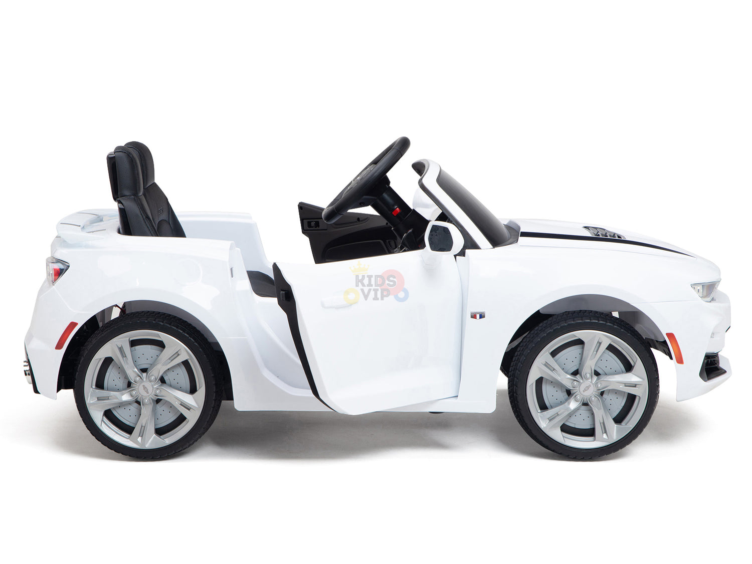 The side view of the White 12V Official Sport Chevrolet Camaro Ride-on showcases its detailed wheels and front logo. With black seats, steering wheel, and an open door revealing a chic interior, its ready for young drivers to enjoy remote-controlled fun.
