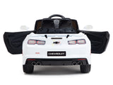 The White 12V Official Sport Chevrolet Camaro Kids and Toddlers Ride-On Car offers open doors, dual exhaust pipes, a sleek black interior, and features the iconic Chevrolet logo. It includes remote control capabilities for young drivers.