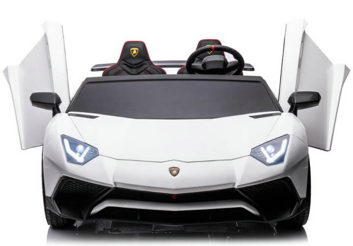 The White 24V/180W Lamborghini SV Limited XXL Edition is a ride-on supercar with upward-opening doors, sleek headlights, detailed front grille, eco-leather seats, a steering wheel, and room for two. Inspired by the SV XXL EDITION, it reaches speeds up to 10 MPH.