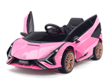The Official 12V Sport Edition Lamborghini Sian Kids and Toddlers Ride On Car is a pink miniature with sleek sports car styling. It boasts scissor doors, black interior, gold wheels, detailed headlights, a visible steering wheel, and is powered by a 12V battery for an authentic driving experience.