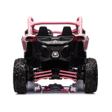 The rear view of the Pink 2x24V/4WD Official Can-Am Maverick Ride on Buggy, LX Performance, features oversized tires, detailed suspension, two seats, and pink design accents such as roll bars and suspension elements in a toy off-road look.