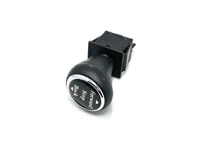 A black control switch with a rounded knob from the Enhance Your Ride with a 2 Seater Mercedes GLC Shifter is on a white background. The knob shows Forward and Stop, and the rectangular base has metal contacts for connection.