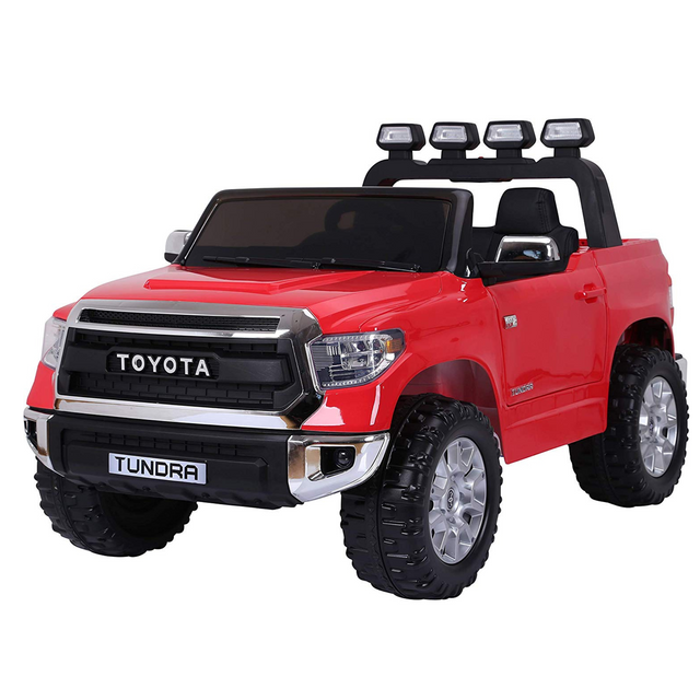 The Red 12v Licensed Toyota Tundra 2-Seater Kids Ride On Truck, RC, features black accents, large wheels, a detailed front grille, and side mirrors. The Eva Edition includes an open roof and visible steering wheel for realistic play with three lights on top. Its perfect for adventurous children.